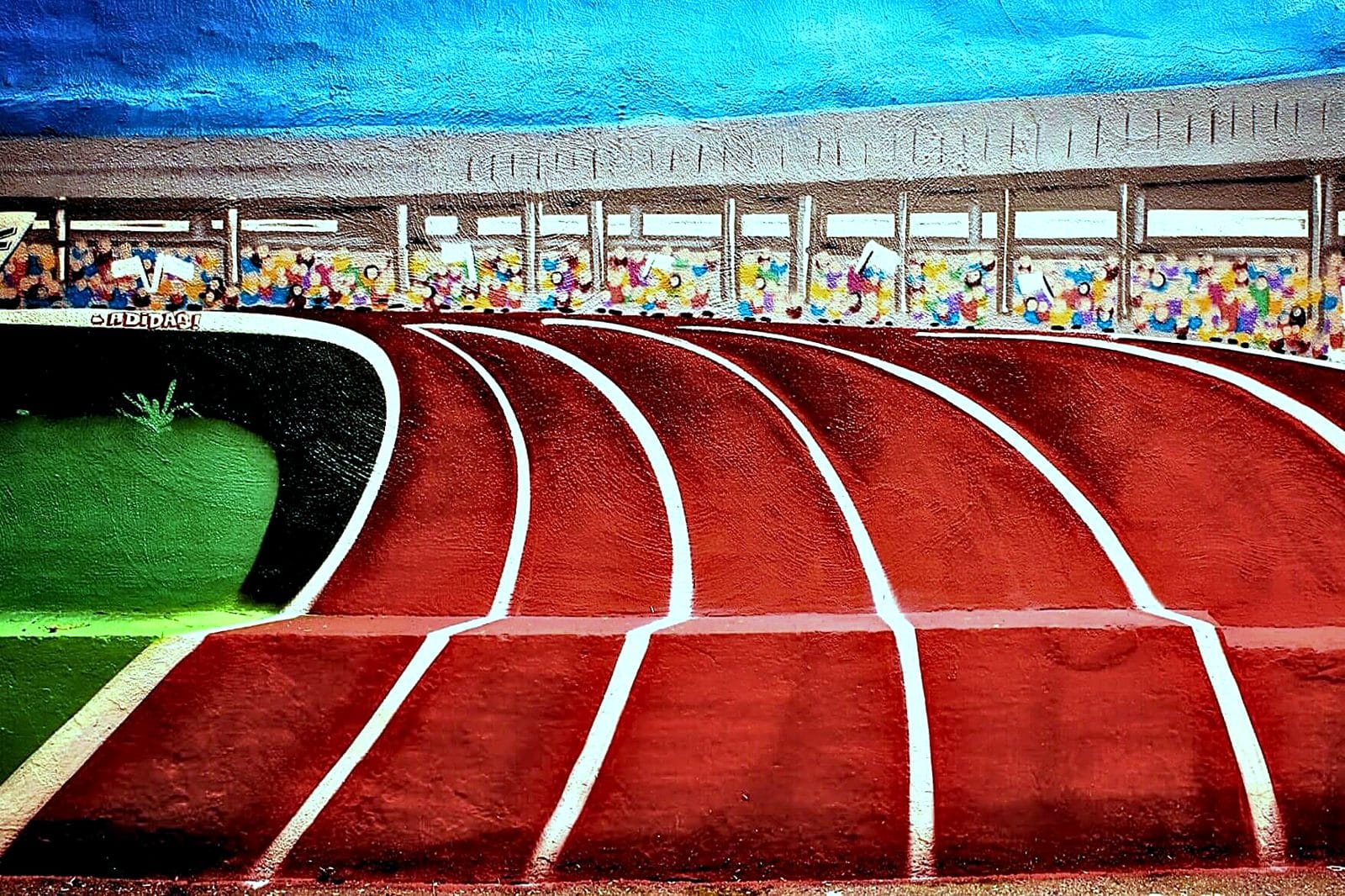 Wandbild eines Leichtathletik-Stadions mit Laufbahn und Tribüne von Open Mike